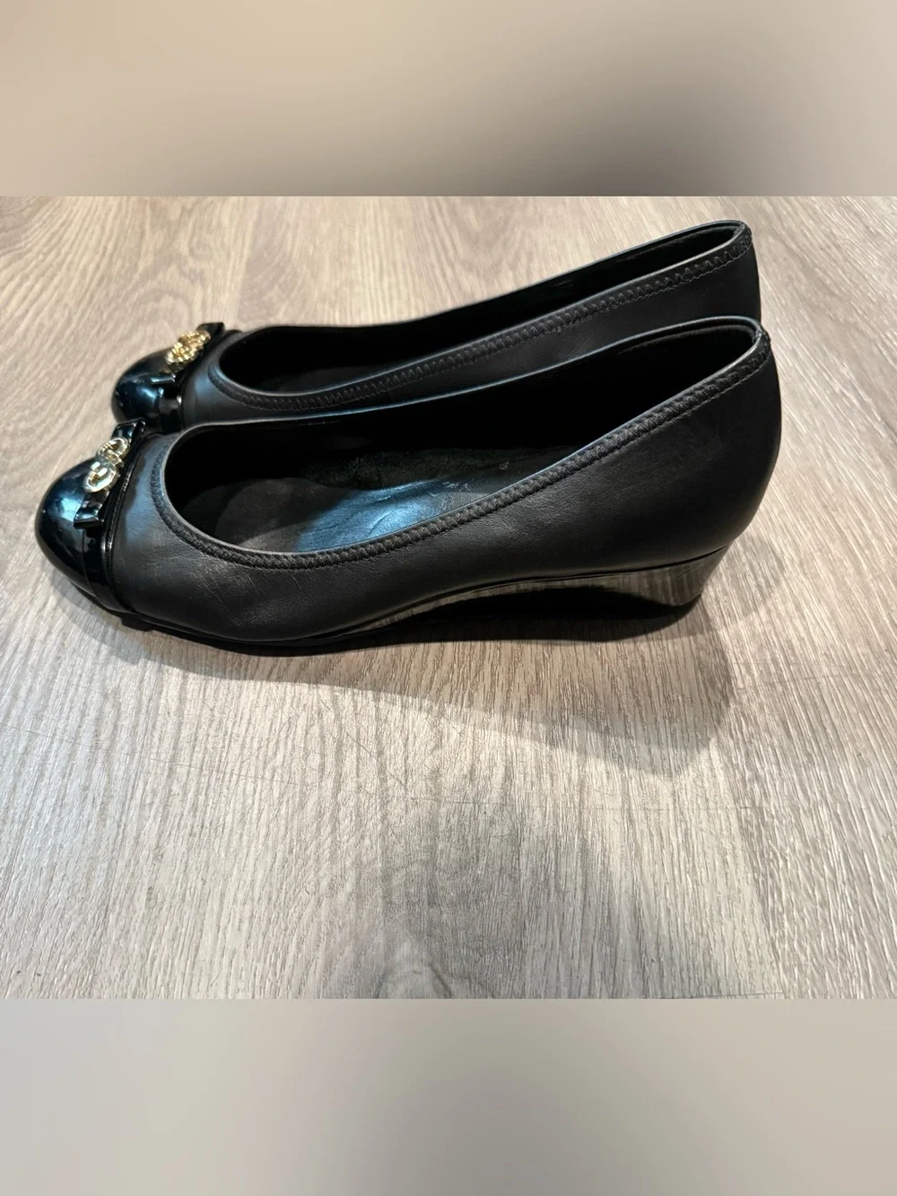 Cole Haan Black Leather Round-Toe Ballet Wedge Heels with Gold Logo Accent